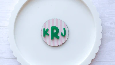 Monogram Scallop Badge Reel Key Chain